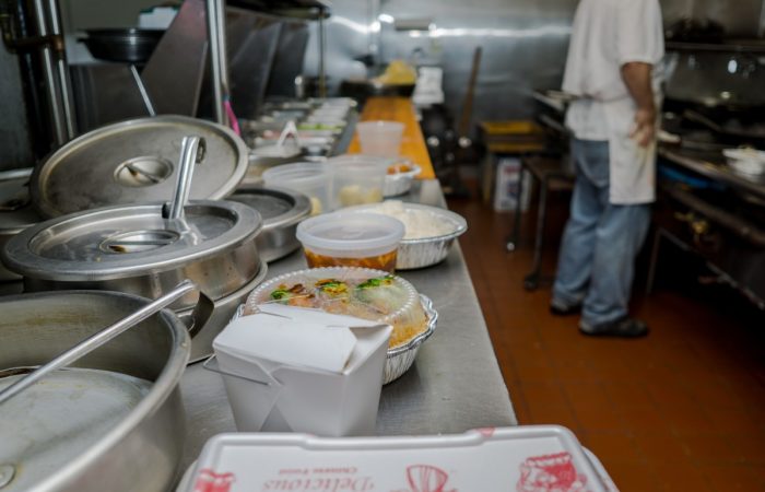 worker-preparing-foods-in-a-chinese-restaurant-kit-2021-10-12-13-31-55-utc
